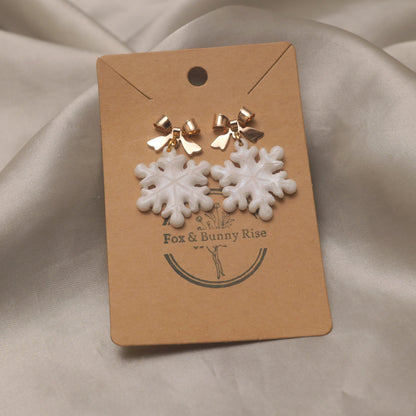 Iridescent Snowflakes with Gold Bows Dangle Earrings