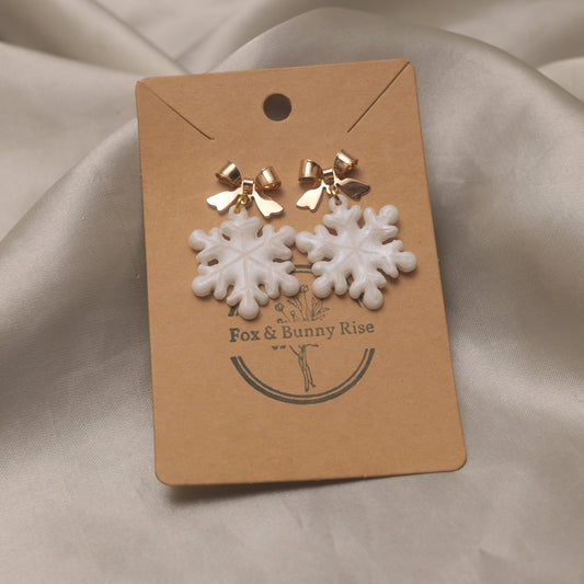 Iridescent Snowflakes with Gold Bows Dangle Earrings
