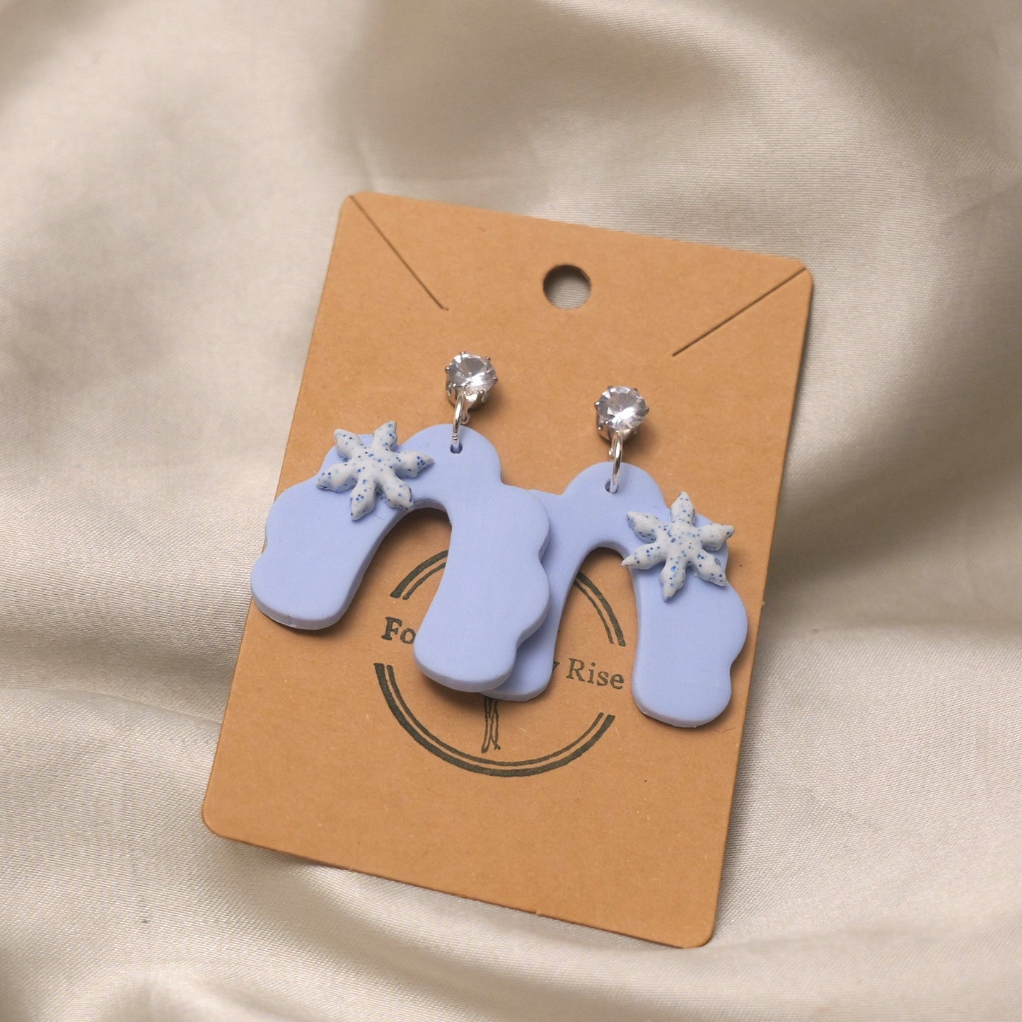 Baby Blue Dangles with Glittery Snowflakes and Cubic Zirconia - Rainbow